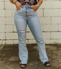 Light Wash High Rise Distressed Hem Boot Cut Jeans
